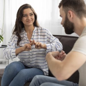 young-people-communicating-through-sign-language_23-2148719650