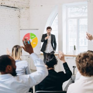 male-speaker-giving-presentation-hall-university-workshop-audience-conference-hall_